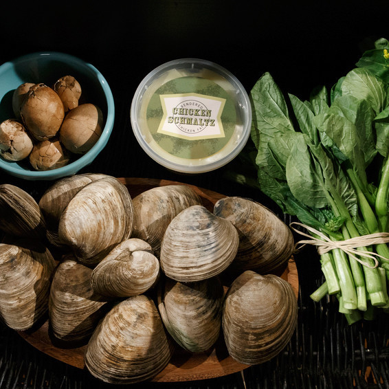 chinese tea eggs clams and greens against black background chinese tea eggs clams and greens against black background