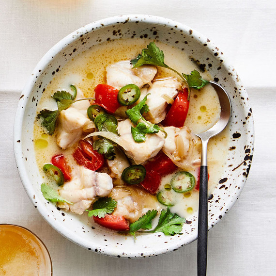 Coconut-Curry Monkfish Soup in speckled bowl with spoon Coconut-Curry Monkfish Soup in speckled bowl with spoon