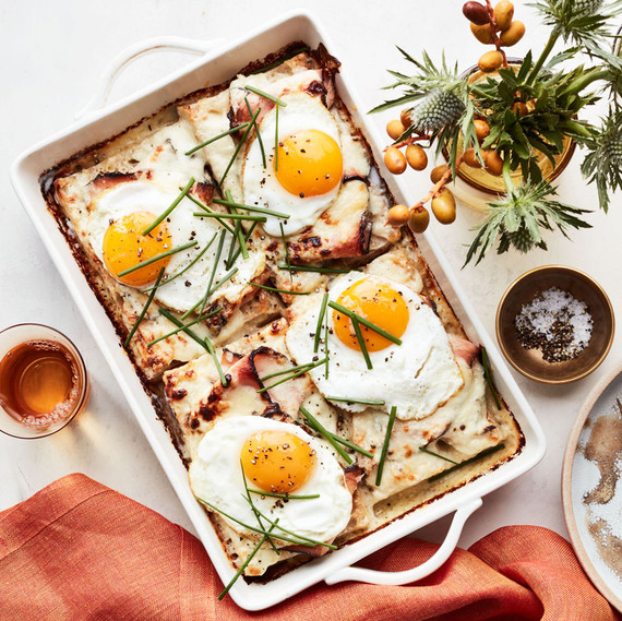 turkey-pastrami croque-madame casserole served in white dish turkey-pastrami croque-madame casserole served in white dish