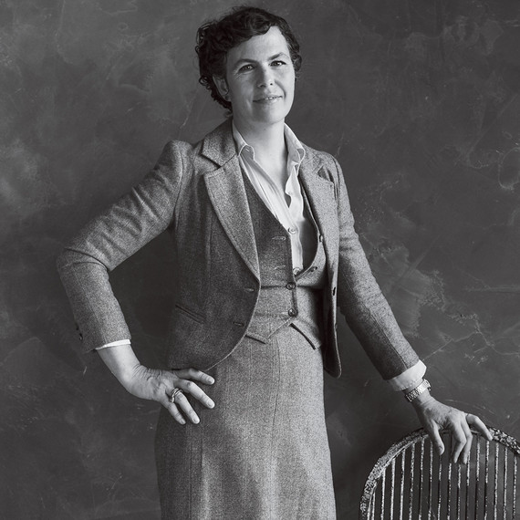 portrait of emily thompson posing next to chair portrait of emily thompson posing next to chair