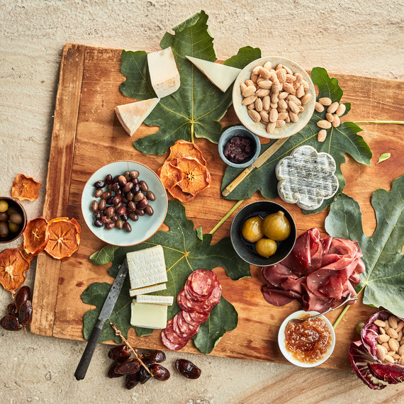 serving board with almonds and meats olives serving board with almonds and meats olives