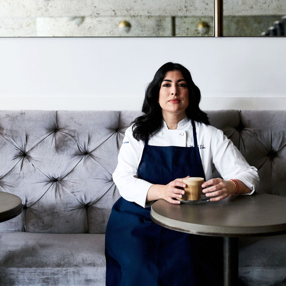 portrait of pastry chef umber ahmad sitting with a cappuccino portrait of pastry chef umber ahmad sitting with a cappuccino