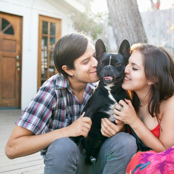 young couple with French Bulldog young couple with French Bulldog