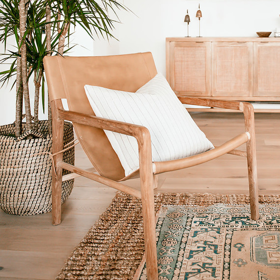 wooden chair with white pillow in living room wooden chair with white pillow in living room