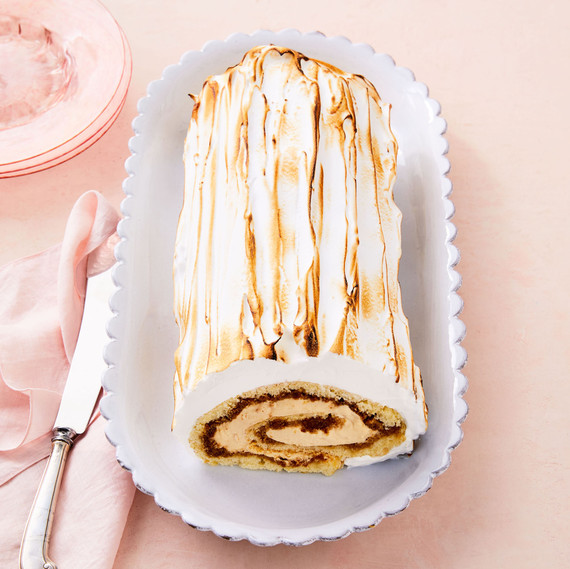 coffee caramel swiss roll on white plate coffee caramel swiss roll on white plate