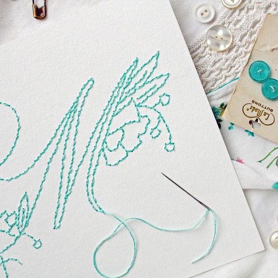stitching embroidered monogram with needle & thread stitching embroidered monogram with needle & thread
