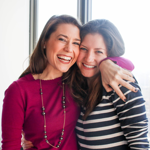 two women hugging purim baking party two women hugging purim baking party