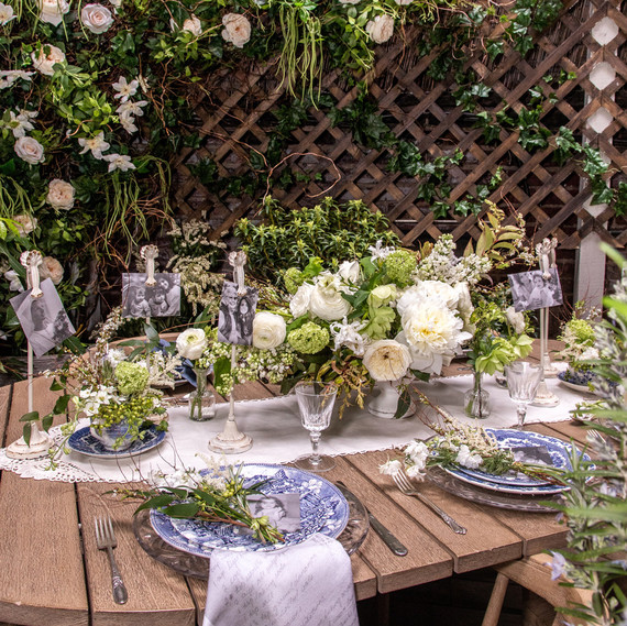 elisa marshall mothers day table setting decorated with white roses and hydrangeas and black and white photographs elisa marshall mothers day table setting decorated with white roses and hydrangeas and black and white photographs