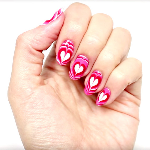 Valentine's Day marbleized heart manicure Valentine's Day marbleized heart manicure
