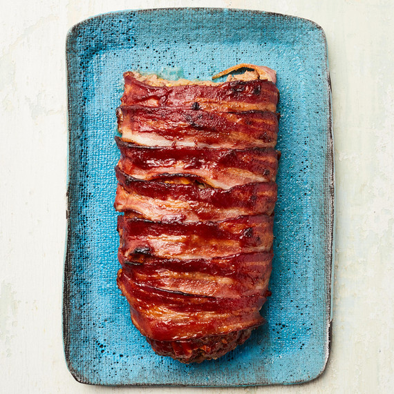 bacon cheeseburger meatloaf on a blue platter bacon cheeseburger meatloaf on a blue platter