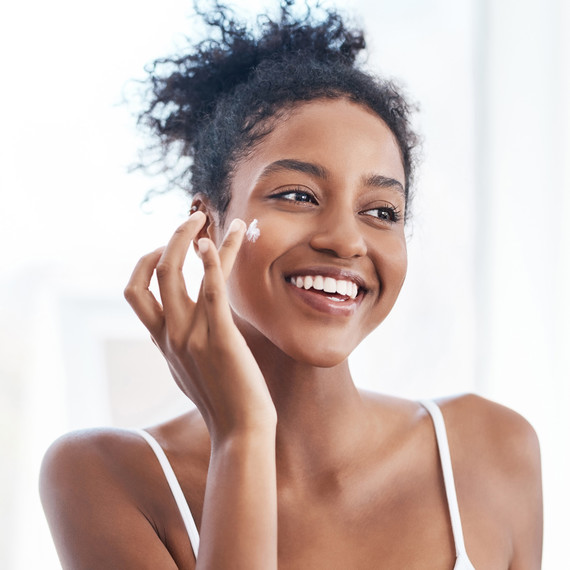 woman applying morning skin care routine woman applying morning skin care routine
