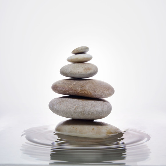 stack of stones in water with ripples stack of stones in water with ripples