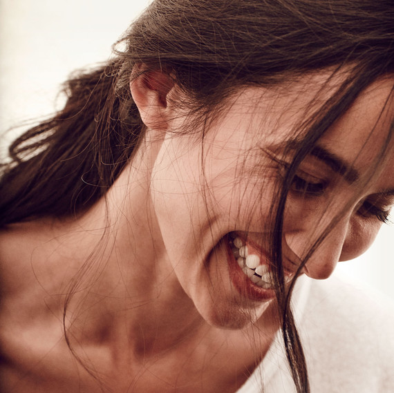 smiling brown haired woman wearing white shirt smiling brown haired woman wearing white shirt