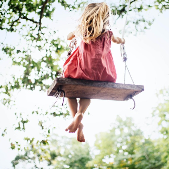 girl swinging playing outside girl swinging playing outside