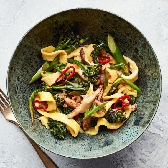 egg noodle broccolini and mushroom stir fry served in green bowl egg noodle broccolini and mushroom stir fry served in green bowl