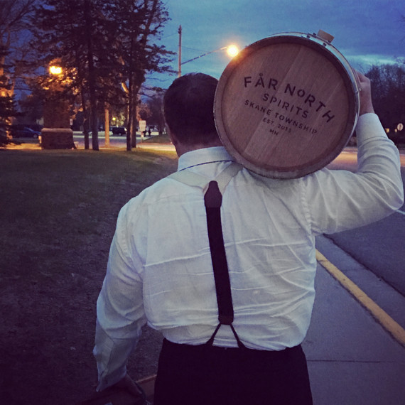 man carrying far north distillery barrel man carrying far north distillery barrel