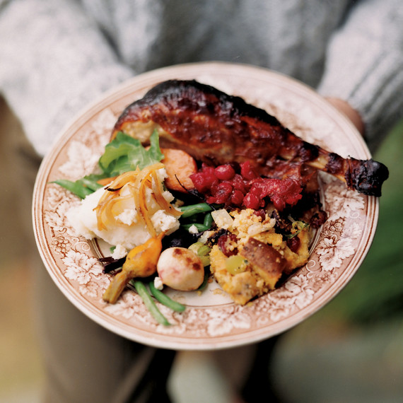 man carrying plate of thanksgiving food man carrying plate of thanksgiving food