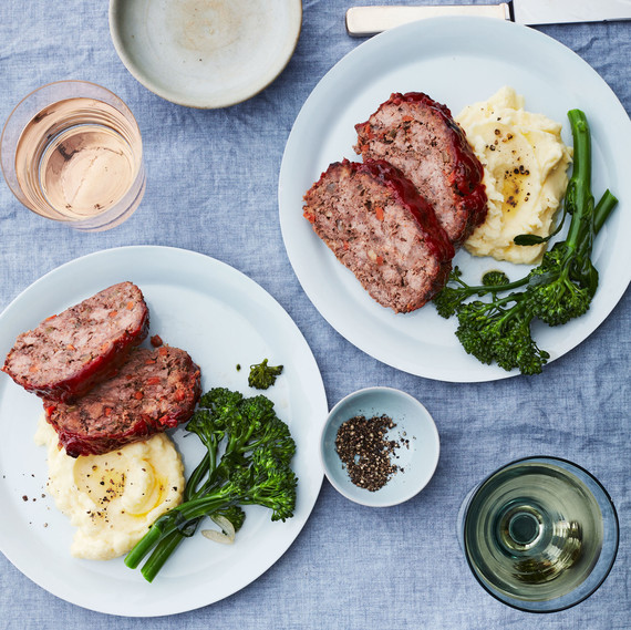 two plates of meatloaf potatoes and broccolini two plates of meatloaf potatoes and broccolini