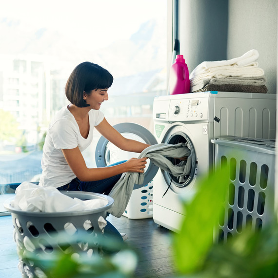 Woman Doing Laundry at Home Woman Doing Laundry at Home