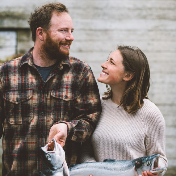 couple holding salmon drifters fish couple holding salmon drifters fish