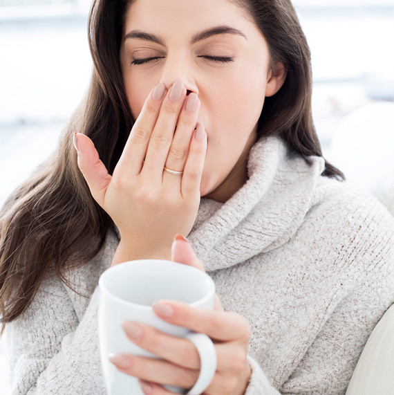 woman yawning sleep deprivation coffee cup tired woman yawning sleep deprivation coffee cup tired