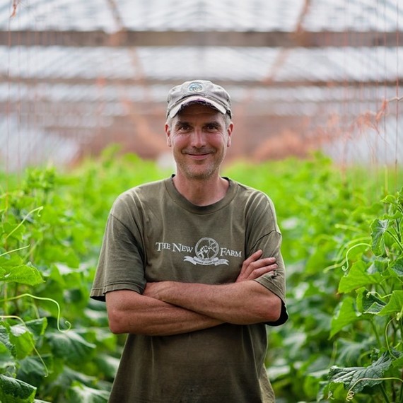Brent Preston standing in front of a crop. Brent Preston standing in front of a crop.