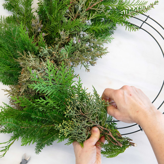 asymmetrical christmas wreath tying on bundles asymmetrical christmas wreath tying on bundles