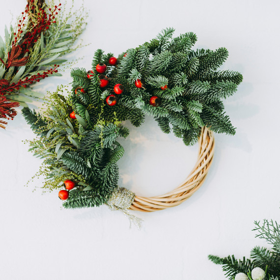 christmas wreath over white background with berries christmas wreath over white background with berries