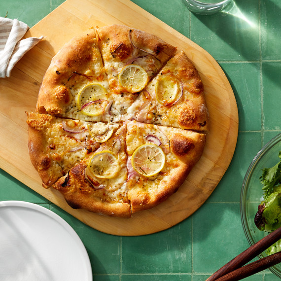 lemon cheese pizza on cutting board lemon cheese pizza on cutting board