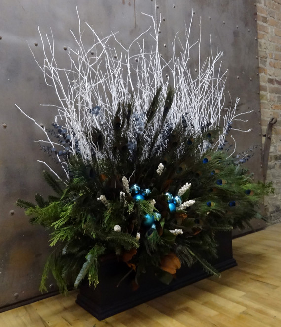 black-window-box-with-white-sticks-and-peacock-feathers.jpg (skyword:370540)