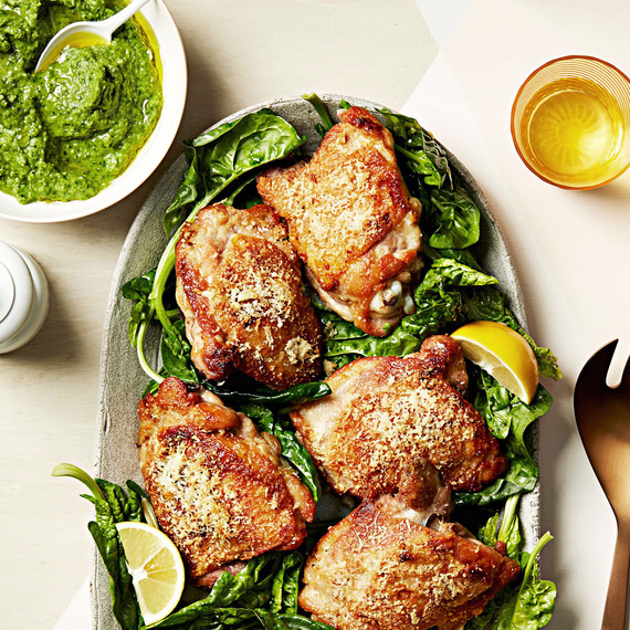 chicken with herbed pea puree and spinach on plate chicken with herbed pea puree and spinach on plate