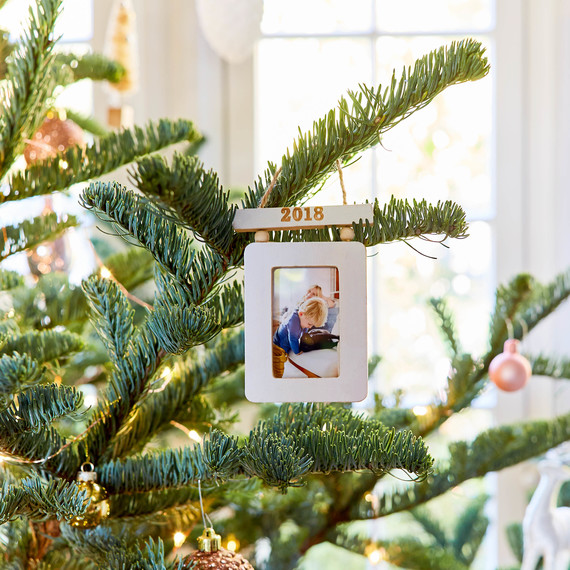 closeup of family ornament on christmas tree closeup of family ornament on christmas tree