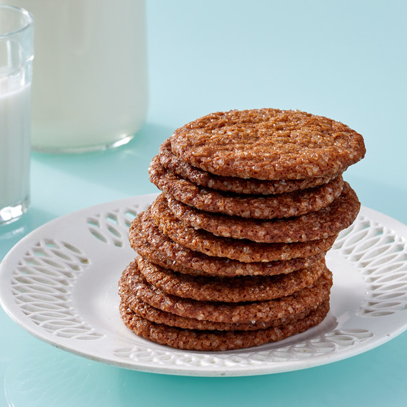 stack of molasses ginger crisps on white plate stack of molasses ginger crisps on white plate