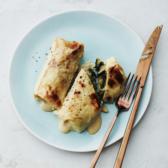 spinach artichoke cannelloni crepes plated and cut spinach artichoke cannelloni crepes plated and cut