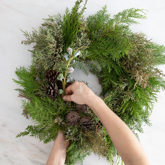asymmetrical christmas wreath adding decorative elements pinecones pods asymmetrical christmas wreath adding decorative elements pinecones pods