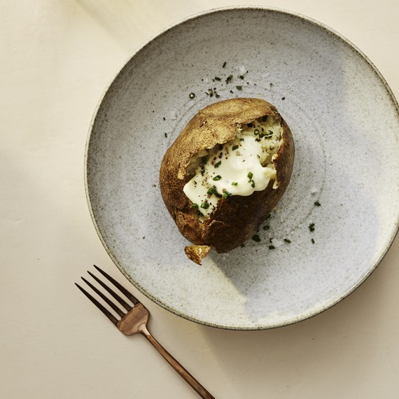 classic baked potato on plate classic baked potato on plate